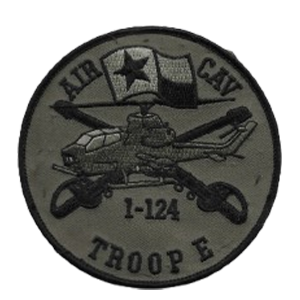 A tactical ("subdued") version of the Troop E, 1st Squadron, 124th Cavalry Regiment patch. Worn on flight suits and jackets during field operations, it could be quickly changed using Velcro.